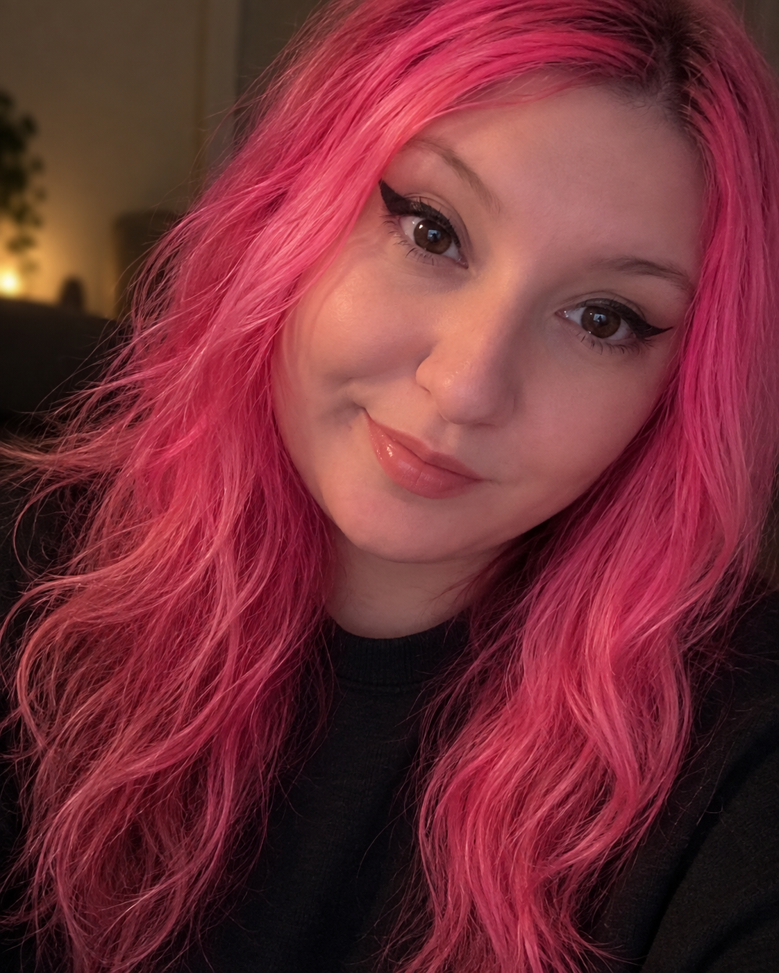 Portrait of NOVA with bright pink hair
